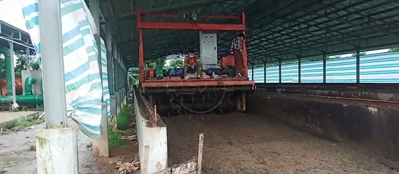 Myanmar client resting on Shunxin Groove Turner working on his chicken manure fertilizer project