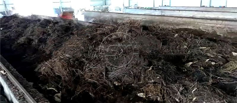 Mixing animal manure with crops waste in composting area