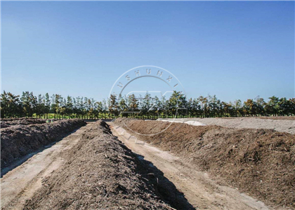 Small scale of raw organic material stacked as piles for composting